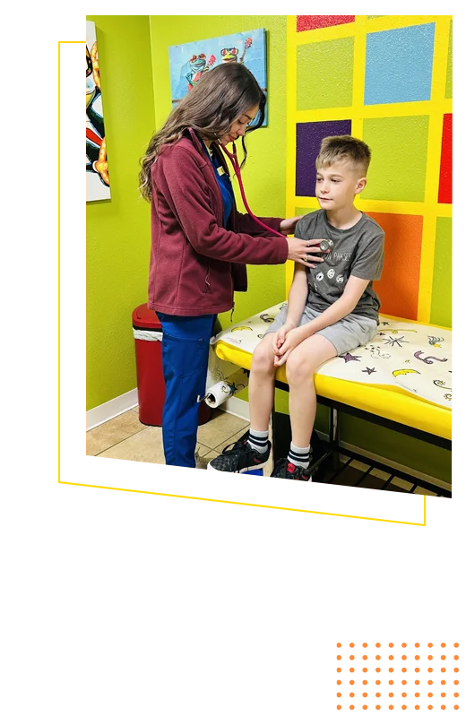 Desiree Jones conducting an exam on a pediatric patient using a stethoscope